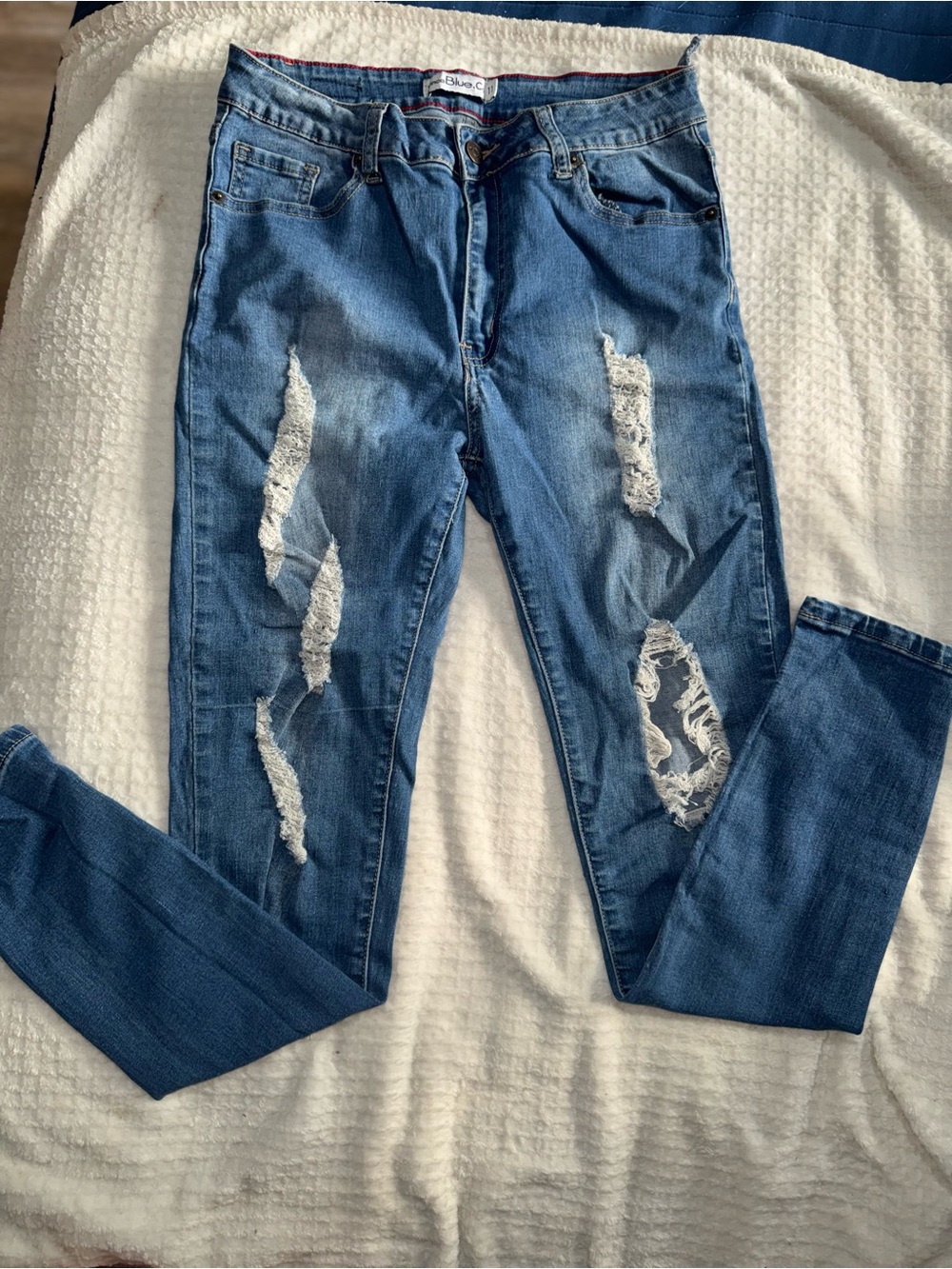 Distressed Blue Denim Jeans